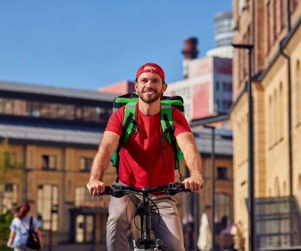 young-cheerful-caucasian-male-courier-with-thermo-2026-03-24-22-35-08-utc (1)